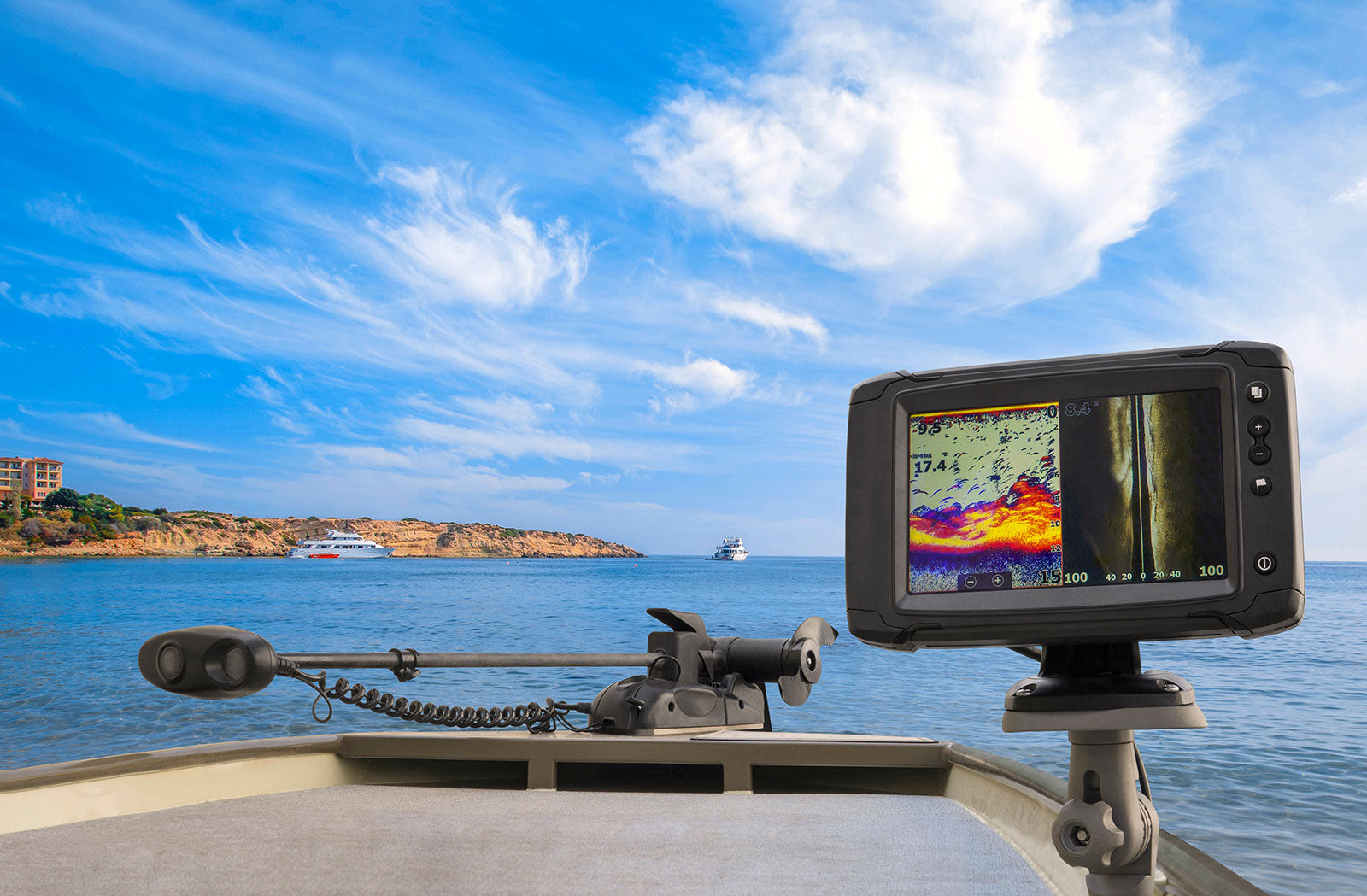 Scenic view of water with a boat featuring a fish finder and trolling motor, representing the Fish Finders category at Atlantis Showroom