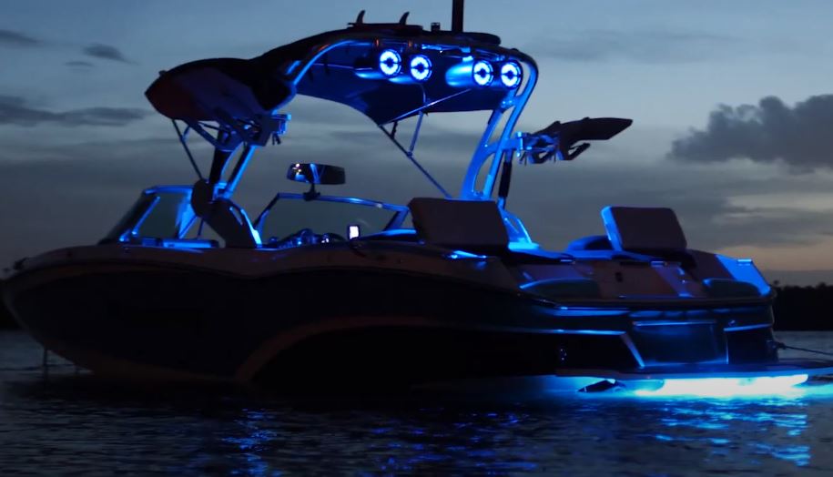Boat illuminated by blue lighting at night, highlighting marine lighting accessories